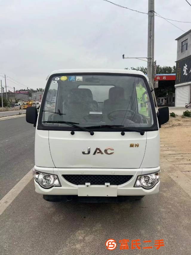 A new blue brand 21 year old diesel vehicle, the Zoomlion 5040 non dumping garbage truck, with a ful